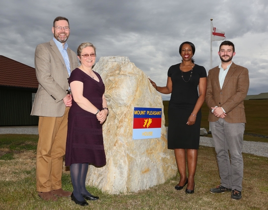 Ombudsman with team at Falkland island stone monument