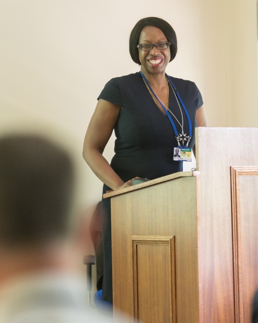 woman standing at a lectern