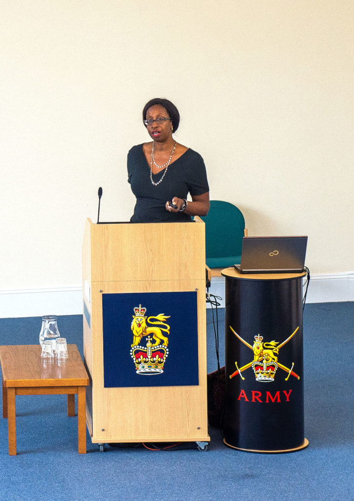 woman standing at a lectern